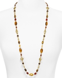 Lauren by Ralph Lauren channels exotic glamor with this beaded necklace. Crafted of 14 karat gold, its antique gold bead work and gorgeous marble-like stations have a far away feel. Lauren by Ralph Lauren channels exotic glamor with this beaded necklace. Crafted of 14 karat gold, its antique gold bead work and gorgeous marble-like stations have a far away feel.