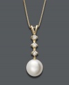 Let elegance define you. Belle de Mer necklace features a cultured freshwater pearl (8-9 mm) highlighted by three, round-cut diamonds (1/8 ct. t.w.). Setting and chain crafted in 14k gold. Approximate length: 18 inches. Approximate drop: 3/4 inch.