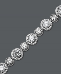 Enlighten your look with a little Arabella. This glamorous tennis bracelet features a unique circular design that highlights dozens of round-cut Swarovski zirconias (22-9/10 ct. t.w.). Crafted in sterling silver. Approximate length: 7 inches. Enlighten your look with a little Arabella. This glamorous tennis bracelet features a unique circular design that highlights dozens of round-cut Swarovski zirconias (22-9/10 ct. t.w.). Crafted in sterling silver. Approximate length: 7 inches.
