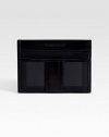 A slim look that slips easily into a jacket pocket, complete with credit cards slots on one side and a transparent ID window on the other. ID window Two credit card slots 4¼W X 3H Nylon/leather Imported 
