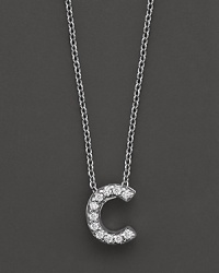 From the Tiny Treasures collection, a diamond C necklace. With signature ruby accent. Designed by Roberto Coin. From the Tiny Treasures collection, a diamond C necklace. With signature ruby accent. Designed by Roberto Coin.