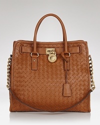 MICHAEL Michael Kors takes texture into day-right territory with this top handle tote. Crafted from leather and spaciously sized, it's an effortless way to update an outfit. MICHAEL Michael Kors takes texture into day-right territory with this top handle tote. Crafted from leather and spaciously sized, it's an effortless way to update an outfit.