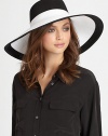 A colorblocked design adds a stylish touch to this dramatic, lightweight topper with elasticized inner band and an oversized brim for maximum sun protection.Brim, about 6.5Elasticized inner band fits most95% UVA/UVB protectionPolypropylene/rayon/polyesterSpot cleanImported and hand-finished in the USA