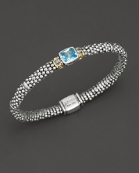 From the Glacier collection, thin caviar rope bracelet with centered blue topaz stone and gold accents. Designed by Lagos. From the Glacier collection, thin caviar rope bracelet with centered blue topaz stone and gold accents. Designed by Lagos.
