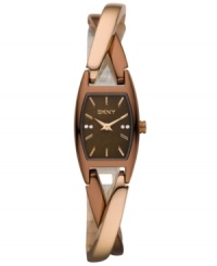 DKNY crafts a twist ending with this chic timepiece. Crafted of brown and rose-gold ion-plated stainless steel twist bracelet and rectangular case. Brown dial features rose-gold tone applied stick indices, crystal accents at three and nine o'clock, logo at twelve o'clock and rose-gold tone two hands. Quartz movement. Water resistant to 30 meters. Two-year warranty. DKNY crafts a twist ending with this chic timepiece. Crafted of brown and rose-gold ion-plated stainless steel twist bracelet and rectangular case. Brown dial features rose-gold tone applied stick indices, crystal accents at three and nine o'clock, logo at twelve o'clock and rose-gold tone two hands. Quartz movement. Water resistant to 30 meters. Two-year warranty.
