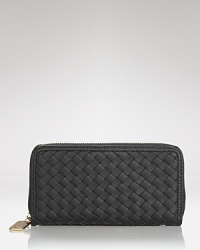 Play up your practical side with this woven vegan leather wallet from Cornelia Guest. Crafted to be cruelty free (and perfectly chic) this piece makes for elegant organization. Play up your practical side with this woven vegan leather wallet from Cornelia Guest. Crafted to be cruelty free (and perfectly chic) this piece makes for elegant organization.
