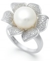 A true beauty. A cultured freshwater pearl (10 mm) and sparkling round-cut diamonds (1/10 ct. t.w.) adorn this exquisite flower ring. Set in sterling silver. Approximate width: 1 inch. Size 7.