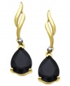 Dark and daring, special-cut onyx (3-1/5 ct. t.w.) gives these wave-shape earrings a sophisticated touch. Crafted from 10k gold with diamond accents. Approximate drop: 1 inch.