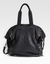 Roomy and shapely, this tote of buttery soft leather is boldly outlined with decorative zippers. Double top handles, 8 drop Detachable shoulder strap, 17½ drop Top zipper close Protective metal feet One inside zip pocket Two inside open pockets Fully lined 14½W X 15½H X 6D Imported