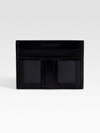 A slim look that slips easily into a jacket pocket, complete with credit cards slots on one side and a transparent ID window on the other. ID window Two credit card slots 4¼W X 3H Nylon/leather Imported A slim look that slips easily into a jacket pocket, complete with credit cards slots on one side and a transparent ID window on the other. ID window Two credit card slots 4¼W X 3H Nylon/leather Imported