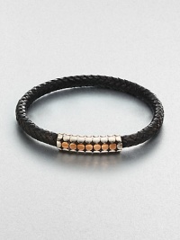 A simple design with modern sensibilities defines this woven leather bracelet, accented by a sterling silver and gold clasp.Sterling silver/GoldLeatherMagnetic claspAbout 3 diam.Imported A simple design with modern sensibilities defines this woven leather bracelet, accented by a sterling silver and gold clasp.Sterling silver/GoldLeatherMagnetic claspAbout 3 diam.Imported