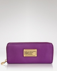 MARC BY MARC JACOBS' zip around leather wallet is a practical accessory with a playful side. In a punched up hue, this wallet is almost too chic to hide in your purse. MARC BY MARC JACOBS' zip around leather wallet is a practical accessory with a playful side. In a punched up hue, this wallet is almost too chic to hide in your purse.