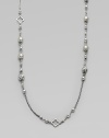 From the Quatrefoil Collection. An extra long sterling silver chain with bead and quatrefoil stations.Sterling silver Can be worn doubled Length, about 48 Lobster clasp closure Imported 