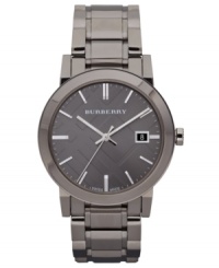 Darkened, mysterious tones give this structured Burberry watch a hint of intrigue. Darkened, mysterious tones give this structured Burberry watch a hint of intrigue.