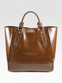 A roomy carryall in textured patent leather, perfect for all your daily essentials.Double top handles, 5½ dropMagnetic top closureProtective metal feetOne inside zip pocketTwo inside open pocketsFully lined15W X 14H X 6DImported A roomy carryall in textured patent leather, perfect for all your daily essentials.Double top handles, 5½ dropMagnetic top closureProtective metal feetOne inside zip pocketTwo inside open pocketsFully lined15W X 14H X 6DImported