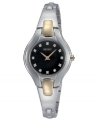 Everyday elegance, updated. This sleek watch from Seiko features a silvertone stainless steel bangle bracelet with goldtone accents. Stainless steel round case. Round black dial with logo and diamond accent indices. Quartz movement. Water resistant to 30 meters. Three-year limited warranty.