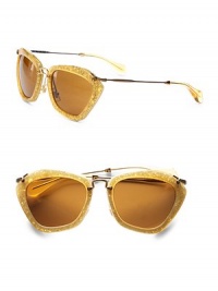 An unique and retro acetate design with a fun pentagon shape, thin metal bridge and temples. Available in red glitter with brown lens, black with grey lens, gold glitter with brown lens, silver glitter with grey lens, pink glitter with brown lens, bronze glitter with bronze lens.Logo temples100% UV protectionMade in Italy An unique and retro acetate design with a fun pentagon shape, thin metal bridge and temples. Available in red glitter with brown lens, black with grey lens, gold glitter with brown lens, silver glitter with grey lens, pink glitter with brown lens, bronze glitter with bronze lens.Logo temples100% UV protectionMade in Italy