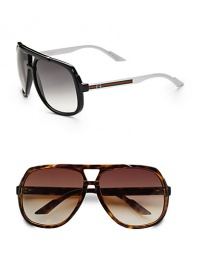 Oversized retro frames with signature stripe detail and G logo. Available in black/white with grey lens or tortoise with brown lens. Brow bar 100% UV protection Made in Italy Oversized retro frames with signature stripe detail and G logo. Available in black/white with grey lens or tortoise with brown lens. Brow bar 100% UV protection Made in Italy