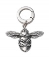 A beeautiful touch. Create a buzz in Fossil's cute bee charm. Crafted in vintage silver tone mixed metal with sparkling crystal details. Approximate length: 1 inch.