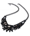 Leave no stone unturned in your quest for style. This bib necklace from Juicy Couture is crafted from brass with jet black stones in a range of shapes for an opulent statement. Approximate length: 18 inches. Approximate drop: 3-1/3 inches. Approximate width: 5 inches.