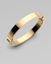 A thin goldtone design with hinge closure, perfect for stacking. Goldtone steelDiameter, about 2¾Hinged closureImported 