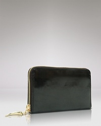 Give into practical accessorizing with this patent Italian leather case wallet from Tusk. It's profile is pocket perfect, while a glossy exterior lends polish. Give into practical accessorizing with this patent Italian leather case wallet from Tusk. It's profile is pocket perfect, while a glossy exterior lends polish.