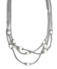 The look of loveliness. AK Anne Klein's chic, three-strand necklace showcases mesh details and imitation plastic pearls. Crafted in a imitation rhodium-tone mixed metal setting. Approximate length: 17-1/2 inches + 3-inch extender. Approximate drop: 1 inch. The look of loveliness. AK Anne Klein's chic, three-strand necklace showcases mesh details and imitation plastic pearls. Crafted in a imitation rhodium-tone mixed metal setting. Approximate length: 17-1/2 inches + 3-inch extender. Approximate drop: 1 inch.