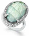 Inspired by nature, this stunning cocktail ring highlights an organically-shaped labradorite (11-1/2 ct. t.w.) stone surrounded by round-cut diamonds (1/4 ct. t.w.). Set in sterling silver. Stone size: 5/8 inch. Ring Size 7.