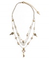 Simple and sweet. A dainty three-layer illusion necklace by Betsey Johnson features delicate chains decorated with acrylic pearls, crystal keys, and heart charms. Crafted in silver and gold tone mixed metal. Approximate length: 16 inches + 3-inch extender. Approximate drop: 3 inches.