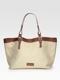 A roomy carryall in durable canvas with luxurious leather trim.Double adjustable leather shoulder straps, 8¼-9 dropMagnetic snap closureOne inside zip pocketTwo inside open pocketsCotton lining13¼W X 11½H X 7DImported A roomy carryall in durable canvas with luxurious leather trim.Double adjustable leather shoulder straps, 8¼-9 dropMagnetic snap closureOne inside zip pocketTwo inside open pocketsCotton lining13¼W X 11½H X 7DImported