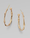 A bamboo hoop in 18K gold for a subtle twist to classic design.18K gold Diameter, about 1 Post backs Made in USA 