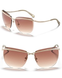Rimless sunglasses with crossover bar detail and curved arms, a ultra chic style from DIANE von FURSTENBERG. Rimless sunglasses with crossover bar detail and curved arms, a ultra chic style from DIANE von FURSTENBERG.