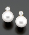 Classically beautiful jewelry with lasting style. These earrings feature cultured freshwater pearl (7-8 mm) and round-cut diamond (1/4 ct. t.w.) set in 14k gold.
