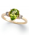 An elegant accent piece in your favorite hue. This exquisite ring features a pear-cut peridot (1-3/8 ct. t.w.) and round-cut diamond accents at the sides. Set in 14k gold.