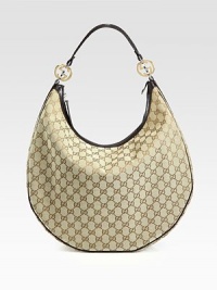 GG fabric with interlocking G ornaments, leather trim, and nickel hardware.Shoulder strap, 10 drop Zip-top closure Inside zip, cell phone and PDA pockets Fully lined 16W X 11H X 5½D Made in Italy GG fabric with interlocking G ornaments, leather trim, and nickel hardware.Shoulder strap, 10 drop Zip-top closure Inside zip, cell phone and PDA pockets Fully lined 16W X 11H X 5½D Made in Italy