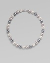 Three gentle tones - grey, nuage and white - come together in a graceful strand of round organic pearls with a sterling silver clasp. 12mm round man-made multicolor pearls Length, about 17 Sterling silver spring clip clasp Made in Spain