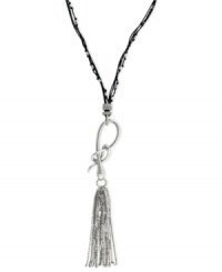 Slip into something new. Jessica Simpson's necklace is crafted from silver-tone mixed metal with a stylish tassel pendant. A snake motif adorns the black chord for a bit of an edge. Approximate length: 28 inches + 6-inch drop. Slip into something new. Jessica Simpson's necklace is crafted from silver-tone mixed metal with a stylish tassel pendant. A snake motif adorns the black chord for a bit of an edge. Approximate length: 28 inches + 6-inch drop.