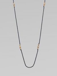 A simply chic design with 14k gold beads clusters on oxidized sterling silver link chain. 14k gold beadsOxidized sterling silverLength, about 40Spring ring closureMade in USA 