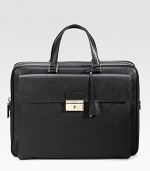 An elegant briefcase in textured saffiano leather with a large envelope exterior pocket. Zip closure Top handles Exterior pocket with clasp closure Interior zip pocket 15¾W X 12H X 2¼D Made in Italy 