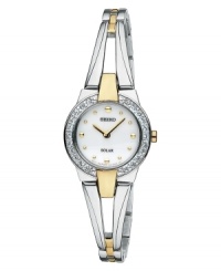 Add a new favorite to your jewelry box with this elegant and energy-efficient watch by Seiko. Polished two-tone stainless steel bangle bracelet and round case, 22mm. Bezel crystallized with Swarovski elements. White dial features gold tone dot markers, two hands and logo. Solar-powered quartz movement. Water resistant to 30 meters. Three-year limited warranty. Add a new favorite to your jewelry box with this elegant and energy-efficient watch by Seiko. Polished two-tone stainless steel bangle bracelet and round case, 22mm. Bezel crystallized with Swarovski elements. White dial features gold tone dot markers, two hands and logo. Solar-powered quartz movement. Water resistant to 30 meters. Three-year limited warranty.