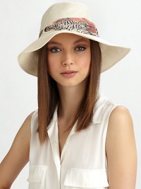 Soft linen, in a floppy style accented with a printed, ruched band of chiffon.Ruched chiffon bandBrim, about 3LinenHand washMade in USA of imported fabric Soft linen, in a floppy style accented with a printed, ruched band of chiffon.Ruched chiffon bandBrim, about 3LinenHand washMade in USA of imported fabric