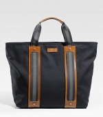 Cotton tote with signature web detail and leather trim. Zip top closure Double handles Leather bottom feet Includes detachable pouch with zip closure Interior zip, cell phone and PDA pockets 18W X 15H X 6D Made in Italy 