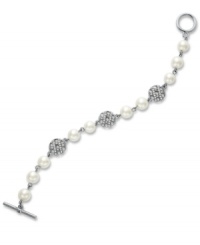 The name says it all...the High Society bracelet from Lauren by Ralph Lauren stands in a class all its own. Pretty glass pearls (8 mm) combine with glass-accented basket weave charms for a look that spells luxury. Setting and toggle clasp crafted in silver tone mixed metal. Approximate length: 7-1/2 inches. The name says it all...the High Society bracelet from Lauren by Ralph Lauren stands in a class all its own. Pretty glass pearls (8 mm) combine with glass-accented basket weave charms for a look that spells luxury. Setting and toggle clasp crafted in silver tone mixed metal. Approximate length: 7-1/2 inches.