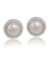 Timeless and tasteful. Carolee's cabochon button earrings epitomize classically chic style. Crafted in silver and gold tone mixed metal, they're embellished with imitation pearls surrounded by sparkling glass accents. Approximate diameter: 1/2 inch.