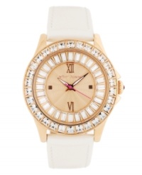 A new neutral for when you want to kick things into gear, by Betsey Johnson. Watch crafted of beige leather strap and round rose-gold tone stainless steel case. Bezel embellished with crystal accents. Textured rose-gold tone dial features ring of baguette-cut crystal accents, applied rose-gold tone Roman numerals at twelve and six o'clock, dot markers at three and nine o'clock, luminous hour and minute hands, signature fuchsia second hand and logo at twelve o'clock. Quartz movement. Water resistant to 30 meters. Two-year limited warranty. A new neutral for when you want to kick things into gear, by Betsey Johnson. Watch crafted of beige leather strap and round rose-gold tone stainless steel case. Bezel embellished with crystal accents. Textured rose-gold tone dial features ring of baguette-cut crystal accents, applied rose-gold tone Roman numerals at twelve and six o'clock, dot markers at three and nine o'clock, luminous hour and minute hands, signature fuchsia second hand and logo at twelve o'clock. Quartz movement. Water resistant to 30 meters. Two-year limited warranty.