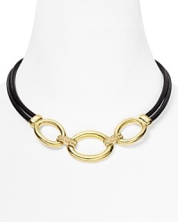 T Tahari makes a mixed material statement with this gold-plate and leather necklace, boasting a bold contrast of tone and texture. T Tahari makes a mixed material statement with this gold-plate and leather necklace, boasting a bold contrast of tone and texture.