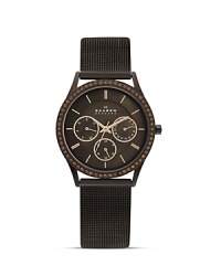 This Skagen piece tackles the tonal watch trend with practical flair, crafted of stainless steel. It features a Mother of Pearl dial and Swarovski crystal accents for added allure. This Skagen piece tackles the tonal watch trend with practical flair, crafted of stainless steel. It features a Mother of Pearl dial and Swarovski crystal accents for added allure.