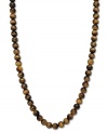 A lovely gradation of neutral hues. This beautiful strand necklace features tiger's eye beads (190 ct. t.w.) in a polished 14k gold setting. Approximate length: 18 inches. Approximate bead diameter: 8-9 mm.