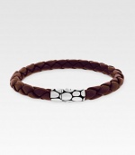 A sterling silver button clasp offers contrasting color and texture to finely braided leather. Length, about 8 Imported