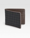 Made from the classic blackwatch tartan, the colors of a historic Scottish force, this bill holder is edged with boarskin embossed leather for a signature feel.One billfold compartmentSix cards slotsCotton/leather4W x 4HImported